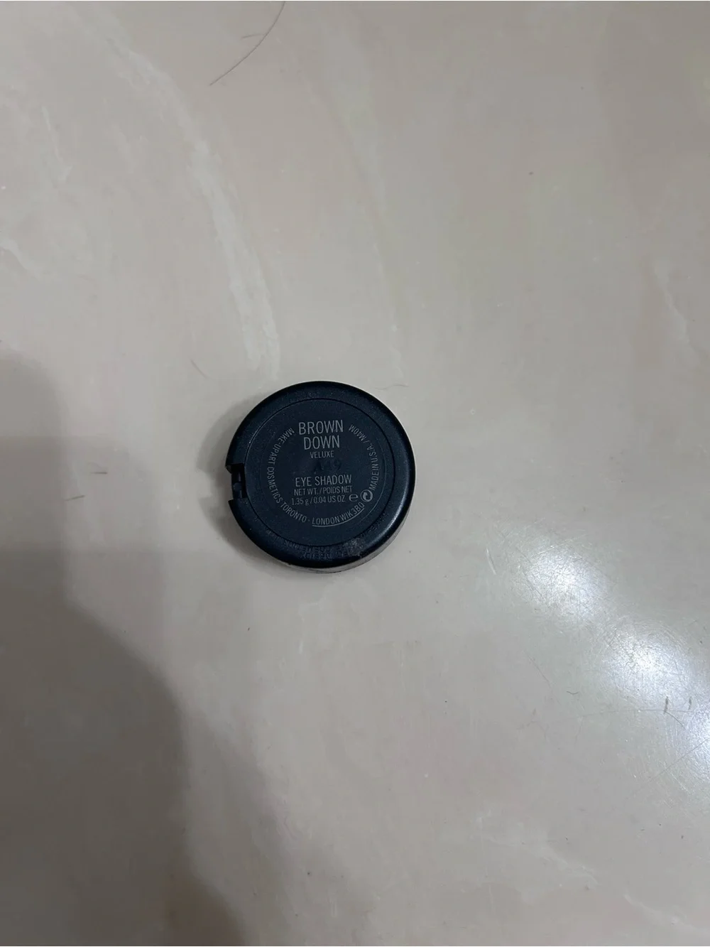 MAC Cosmetics brown down